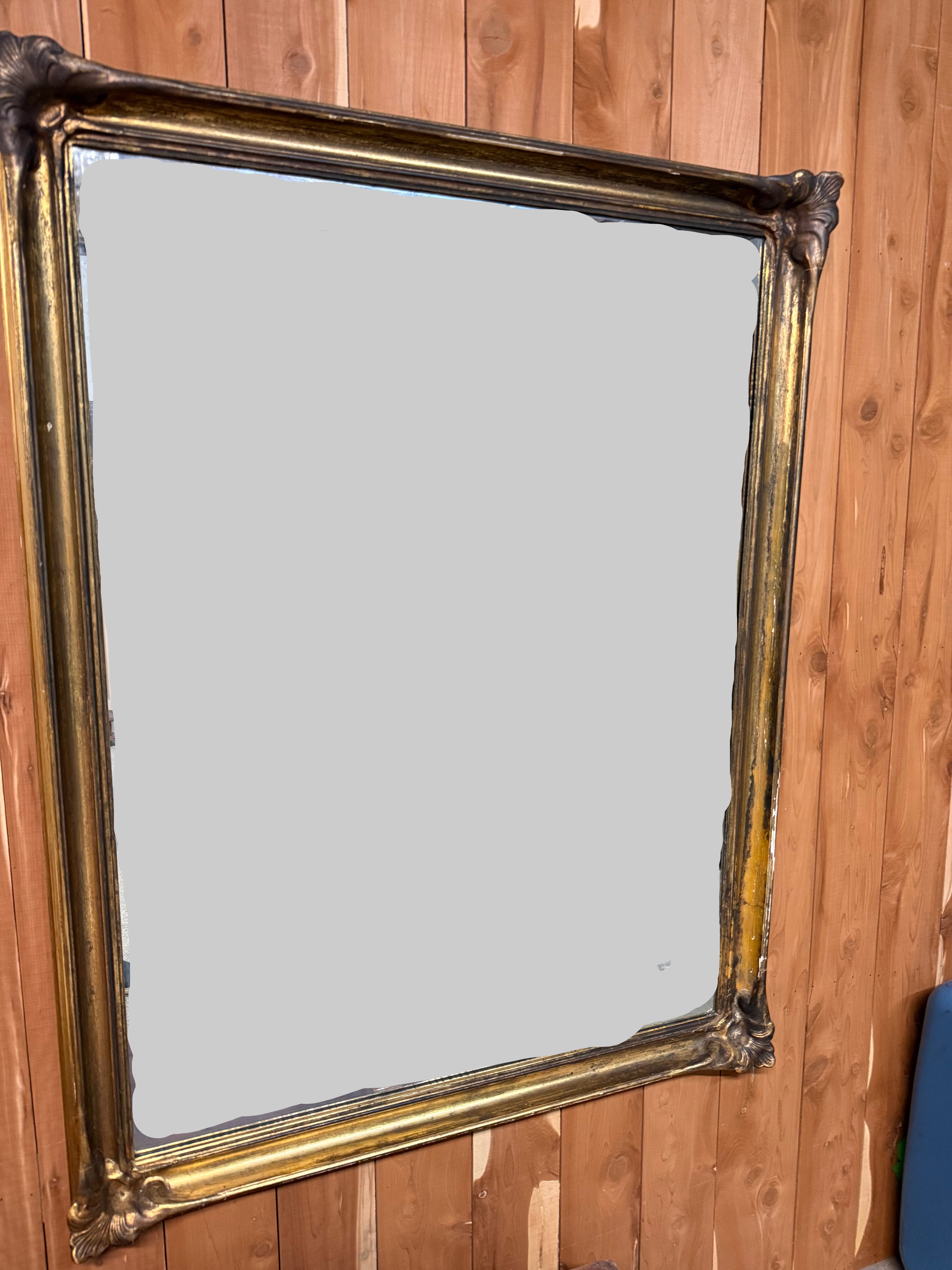 Vintage gold-leaf framed wall mirror, 42 by 54 inches
